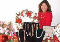 Craft sale coordinator Deanna Mukai (RA) with hand-made jewelry.
