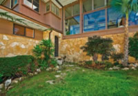 Main entry to the Puu Panini house. The steel and bronze doors were salvaged from the Alexander Young Building.