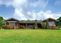 Architectural design incorporates Old Hawaii Plantation and Romanesque/Gothic elements.