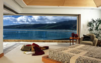Master bedroom opens up to lanai and unobstructed ocean view with motorized, pocketing sliding doors.